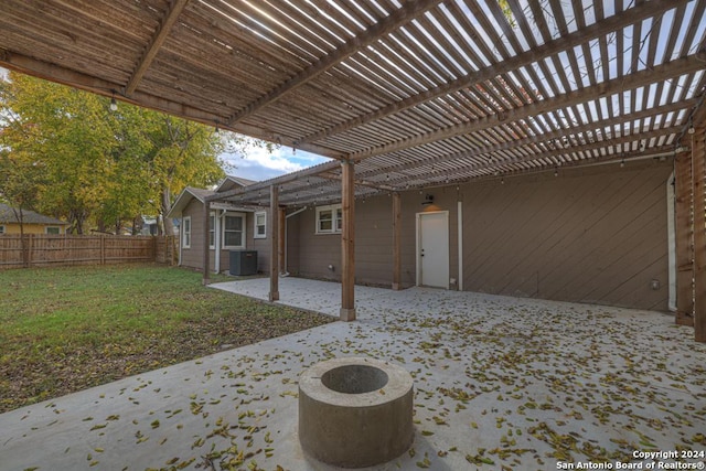 view of patio / terrace with a fire pit, central AC unit, and a pergola