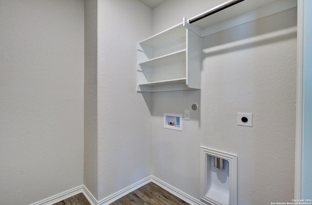 clothes washing area with electric dryer hookup, gas dryer hookup, dark hardwood / wood-style flooring, and washer hookup