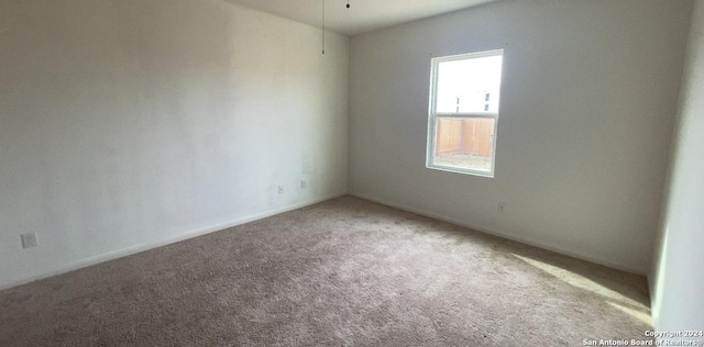 unfurnished room featuring carpet floors