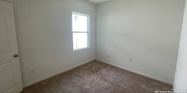 spare room with carpet floors