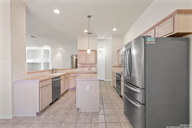 kitchen featuring decorative light fixtures, light tile patterned floors, stainless steel appliances, and light brown cabinetry