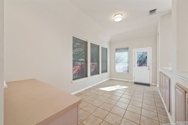 foyer entrance featuring light tile patterned floors