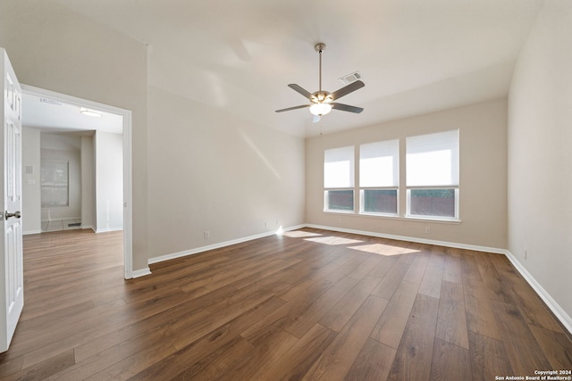 unfurnished room with ceiling fan and dark hardwood / wood-style flooring