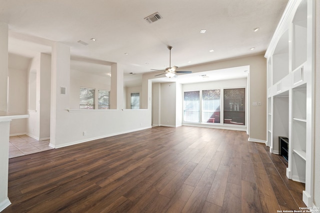 unfurnished living room featuring ceiling fan, hardwood / wood-style floors, and plenty of natural light