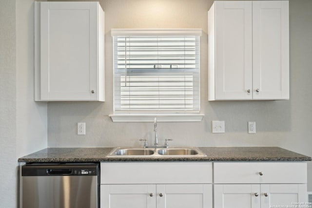 kitchen with dishwasher, white cabinets, and sink