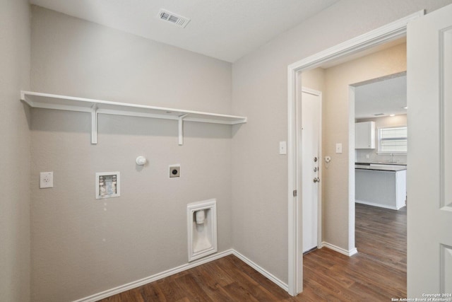 laundry area with washer hookup, electric dryer hookup, gas dryer hookup, and dark wood-type flooring