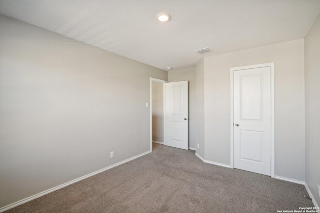 unfurnished bedroom with carpet