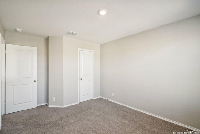 unfurnished bedroom with carpet floors