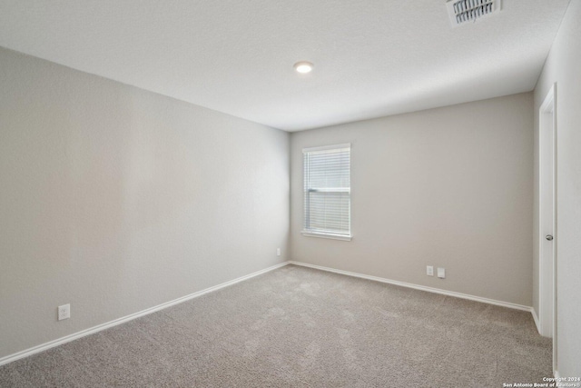 unfurnished room with carpet floors