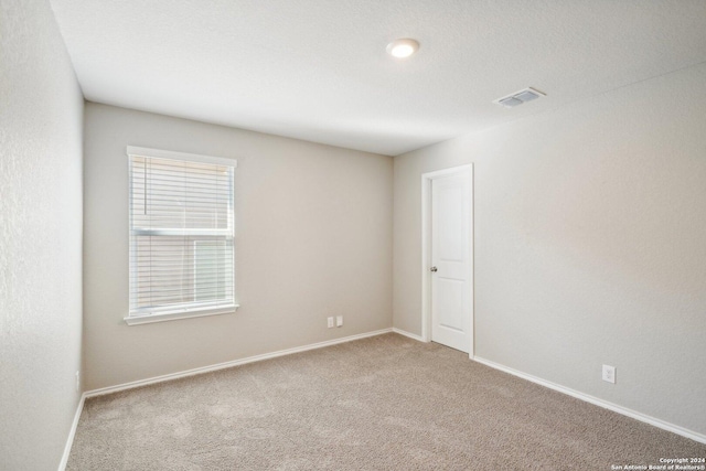 unfurnished room with carpet flooring