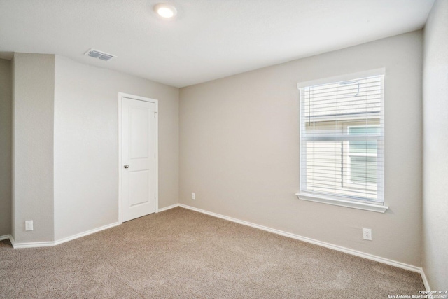 unfurnished room with carpet floors