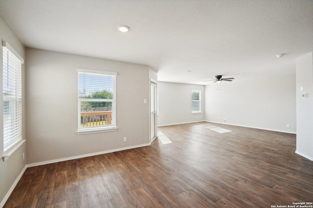 spare room featuring a textured ceiling, dark hardwood / wood-style floors, and ceiling fan