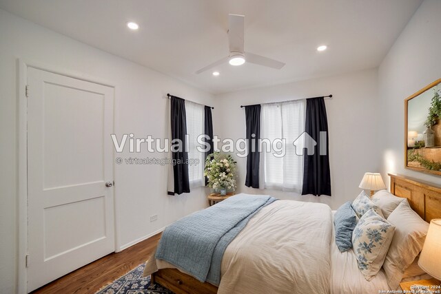 bedroom with ceiling fan and hardwood / wood-style flooring