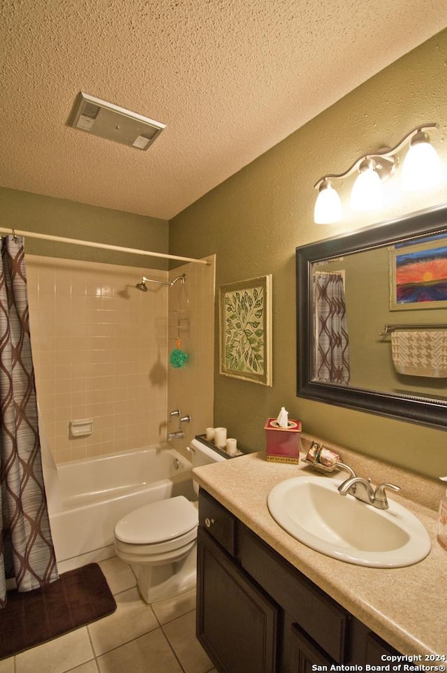 full bathroom with tile patterned floors, a textured ceiling, toilet, shower / tub combo with curtain, and vanity