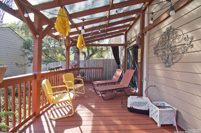 wooden deck featuring a pergola