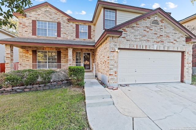 front of property featuring a porch and a garage