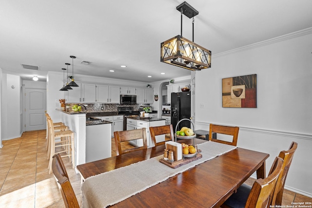 tiled dining area with crown molding