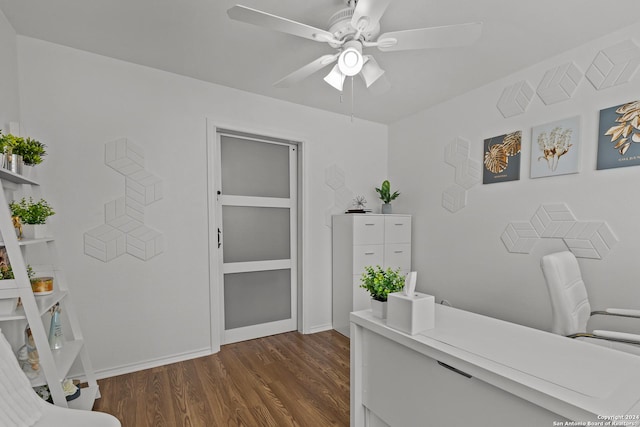 home office with ceiling fan and dark wood-type flooring