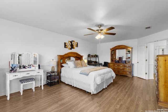 bedroom featuring light hardwood / wood-style floors and ceiling fan