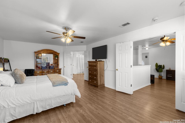 bedroom with hardwood / wood-style flooring and ceiling fan