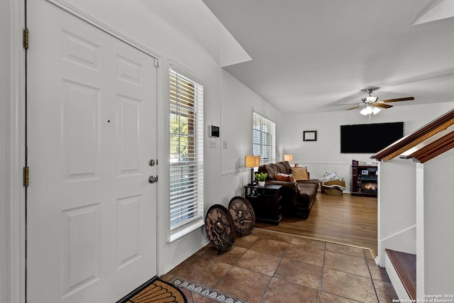 foyer featuring ceiling fan and dark hardwood / wood-style floors