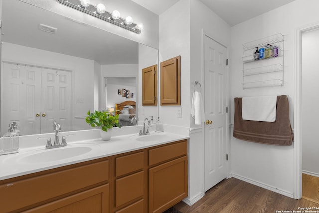 bathroom featuring vanity and hardwood / wood-style flooring