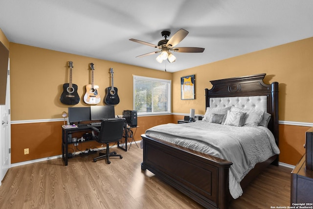 bedroom with ceiling fan and light wood-type flooring