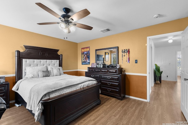 bedroom featuring ceiling fan and light hardwood / wood-style floors