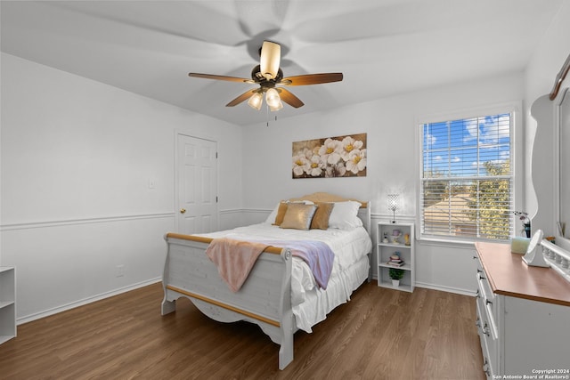 bedroom featuring wood-type flooring, a closet, and ceiling fan