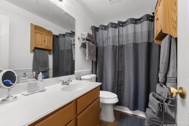 bathroom featuring hardwood / wood-style floors, vanity, toilet, and a shower with curtain