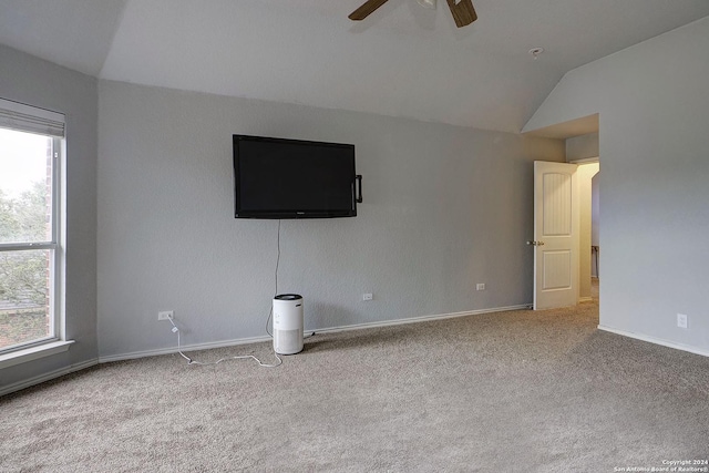 unfurnished living room with light carpet, plenty of natural light, lofted ceiling, and ceiling fan