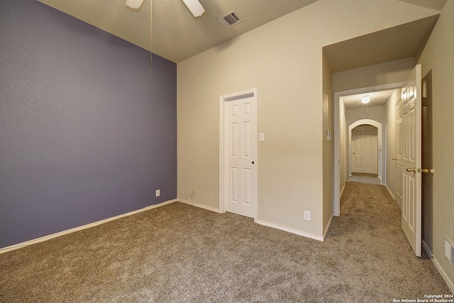 unfurnished bedroom with carpet flooring and ceiling fan