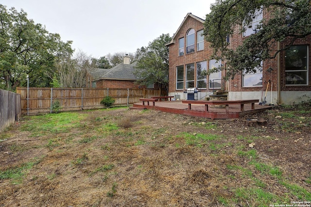 view of yard featuring a wooden deck