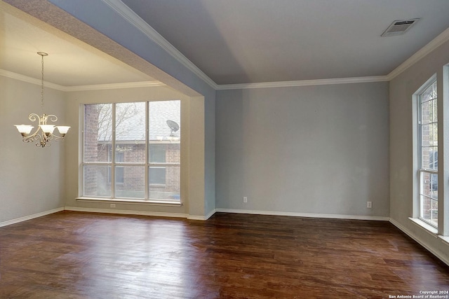 unfurnished room with a chandelier, dark hardwood / wood-style flooring, plenty of natural light, and crown molding