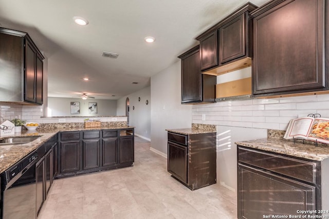 kitchen with backsplash, sink, stainless steel dishwasher, ceiling fan, and dark brown cabinets