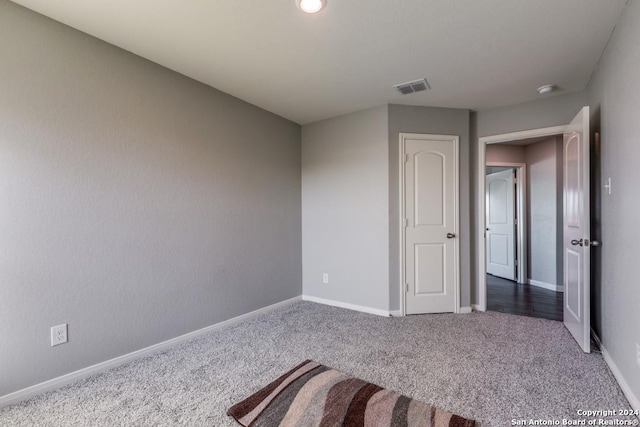 unfurnished bedroom with carpet flooring