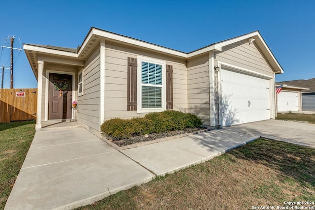 ranch-style home featuring a garage