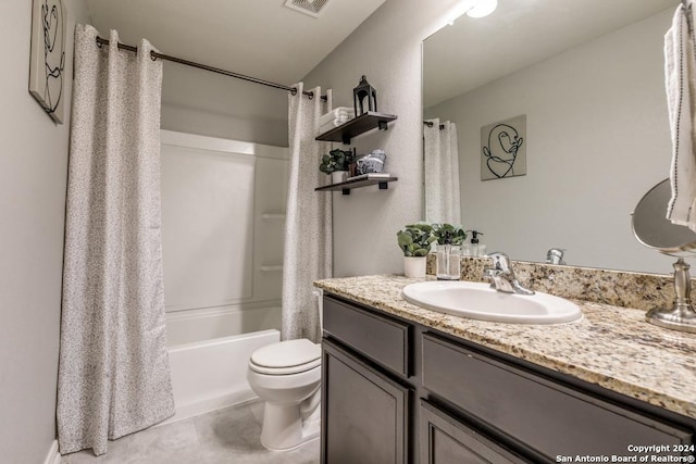 full bathroom with tile patterned flooring, shower / bath combo, toilet, and vanity