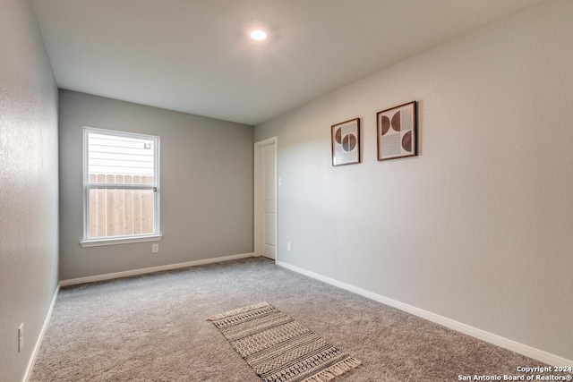 spare room featuring carpet flooring