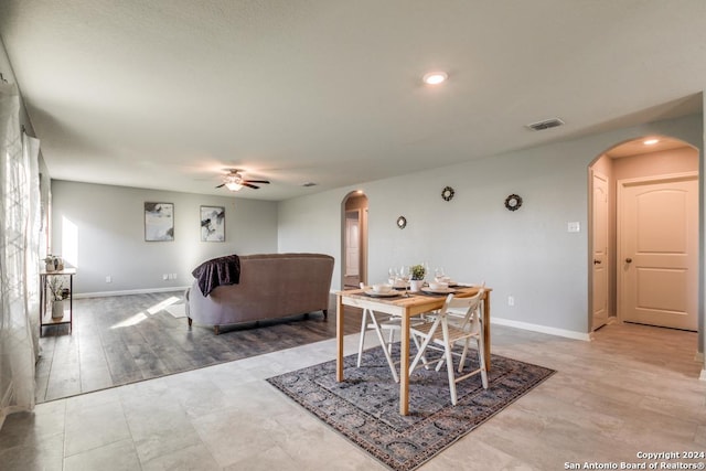 dining room with ceiling fan and light hardwood / wood-style floors