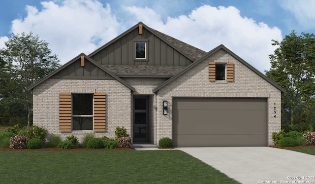 view of front of property featuring a front yard and a garage