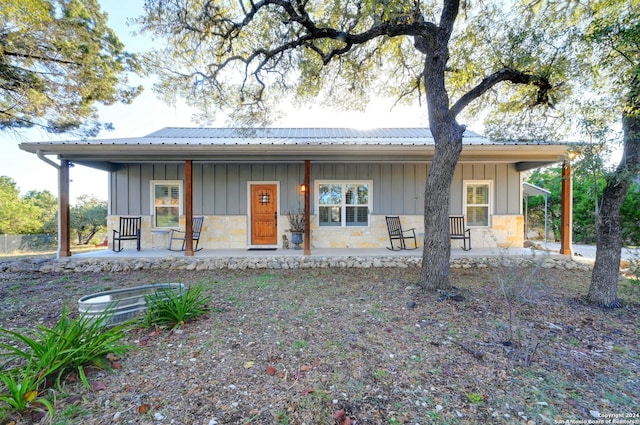 view of front of property featuring a porch and central AC unit