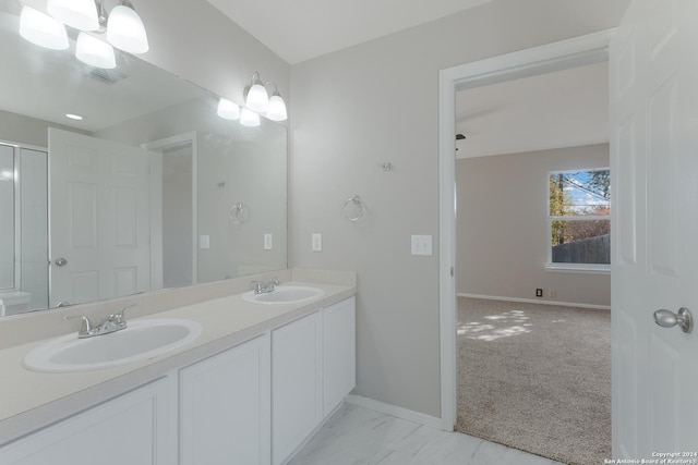 bathroom featuring vanity and a chandelier