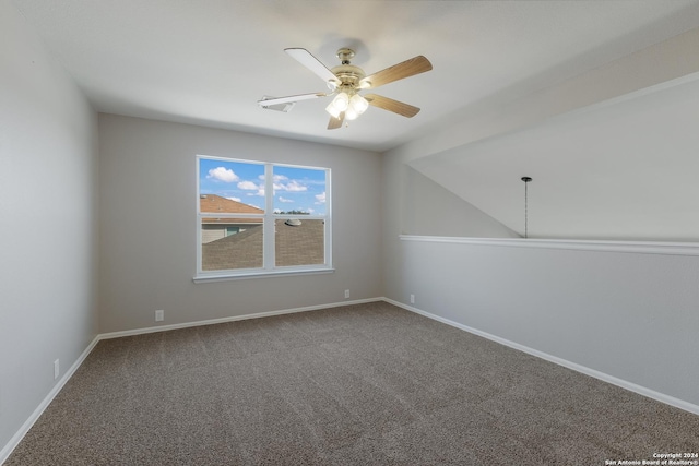 spare room featuring carpet and ceiling fan