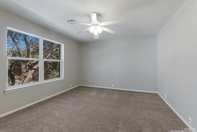 carpeted empty room with ceiling fan