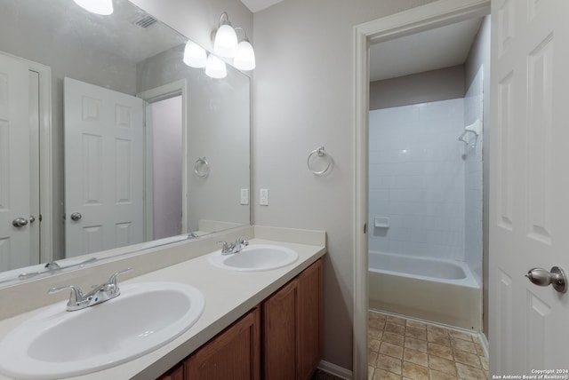 bathroom with vanity and  shower combination