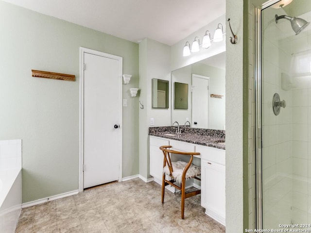 bathroom featuring vanity and a shower with shower door