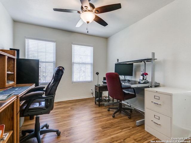 office space with hardwood / wood-style floors and ceiling fan