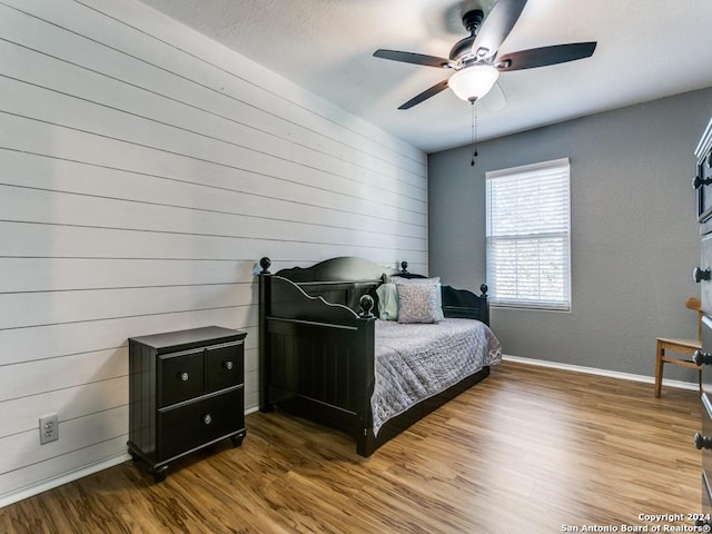 bedroom featuring ceiling fan and hardwood / wood-style floors