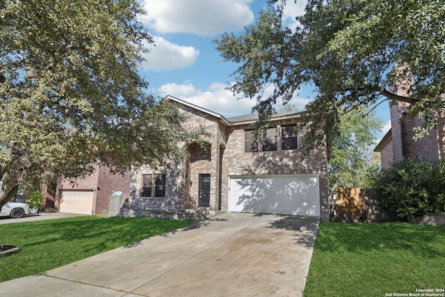 view of front of home featuring a front lawn and a garage